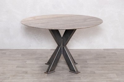 round-travertine-top-table-gunmetal-tank-trap-base